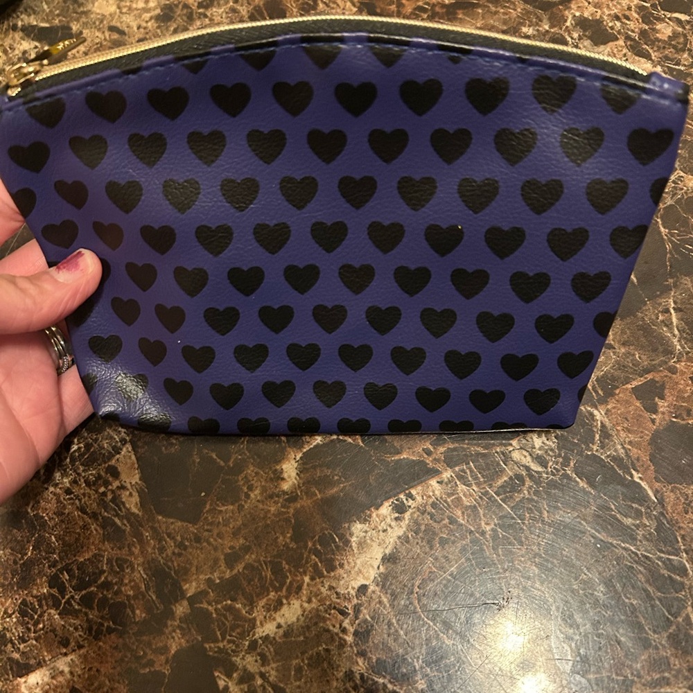 Ipsy indigo make up bag with black heart print